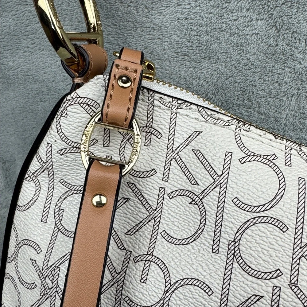 Calvin Klein Logo Print Hobo Bag in Cream and Brown